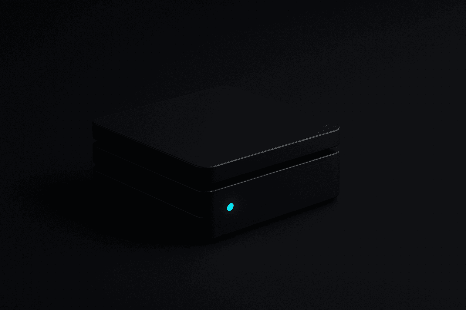 A dark machined console of three stacked slabs. The front slab is pulled slightly forward and carries one small glowing cyan mark. The other